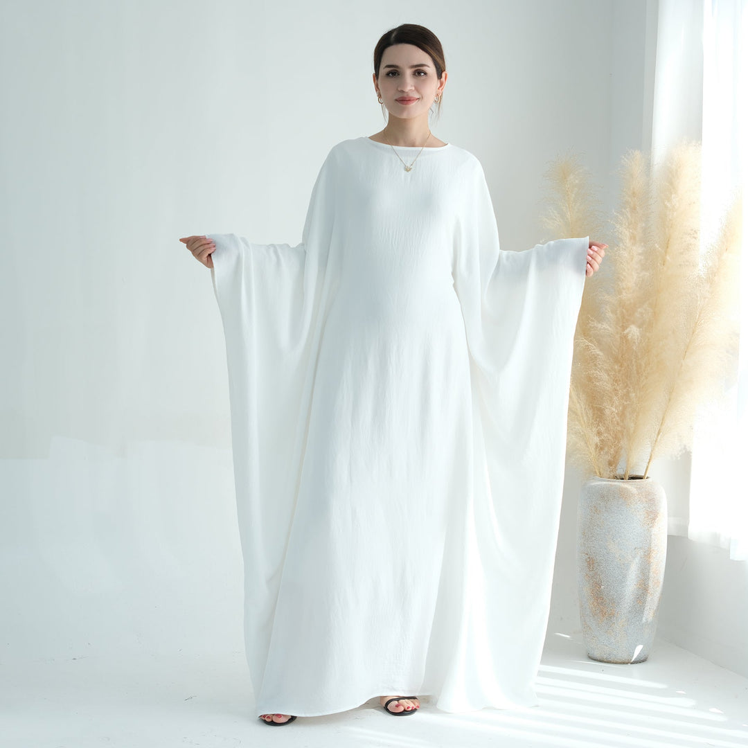 Get trendy with Naimah Textured Butterfly Abaya - White -  available at Voilee NY. Grab yours for $54.90 today!