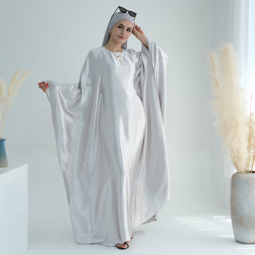 Get trendy with Alisha Butterfly Satin Abaya - Dove - Dresses available at Voilee NY. Grab yours for $72.90 today!
