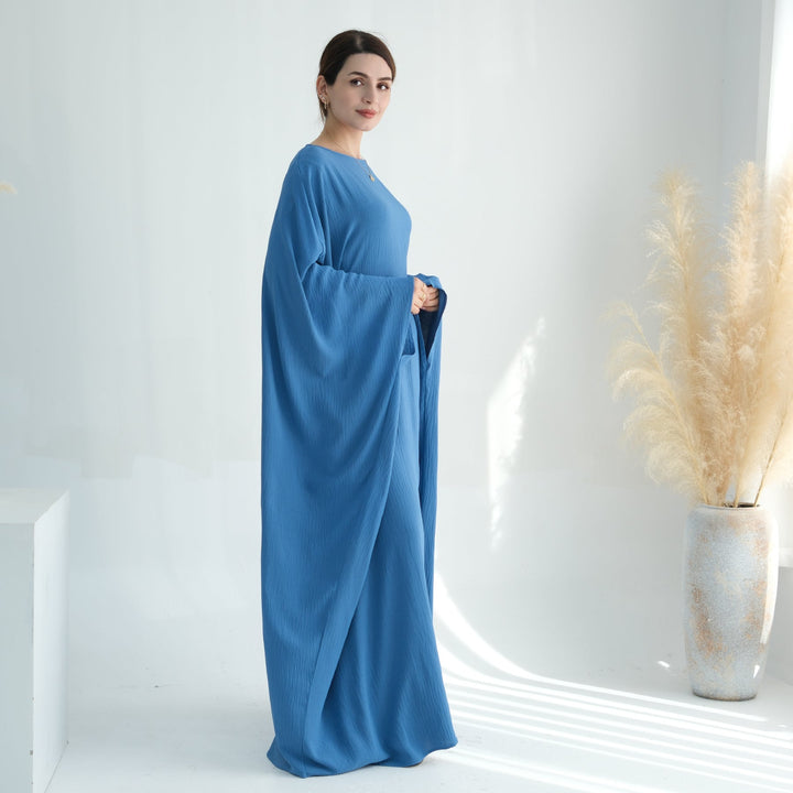 Get trendy with Naimah Textured Butterfly Abaya - Teal -  available at Voilee NY. Grab yours for $54.90 today!