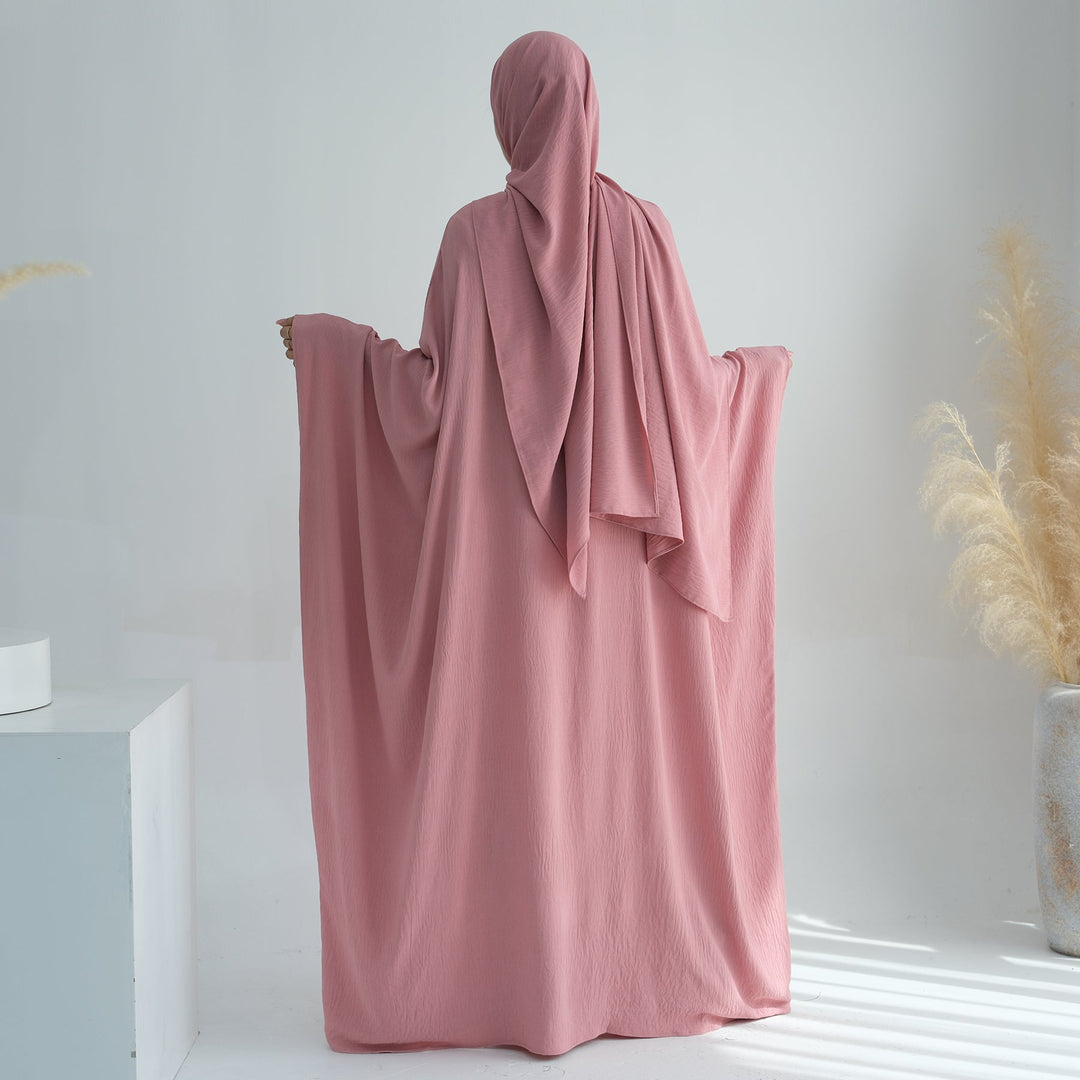 Get trendy with Naimah Textured Butterfly Abaya - Pink Coral -  available at Voilee NY. Grab yours for $54.90 today!