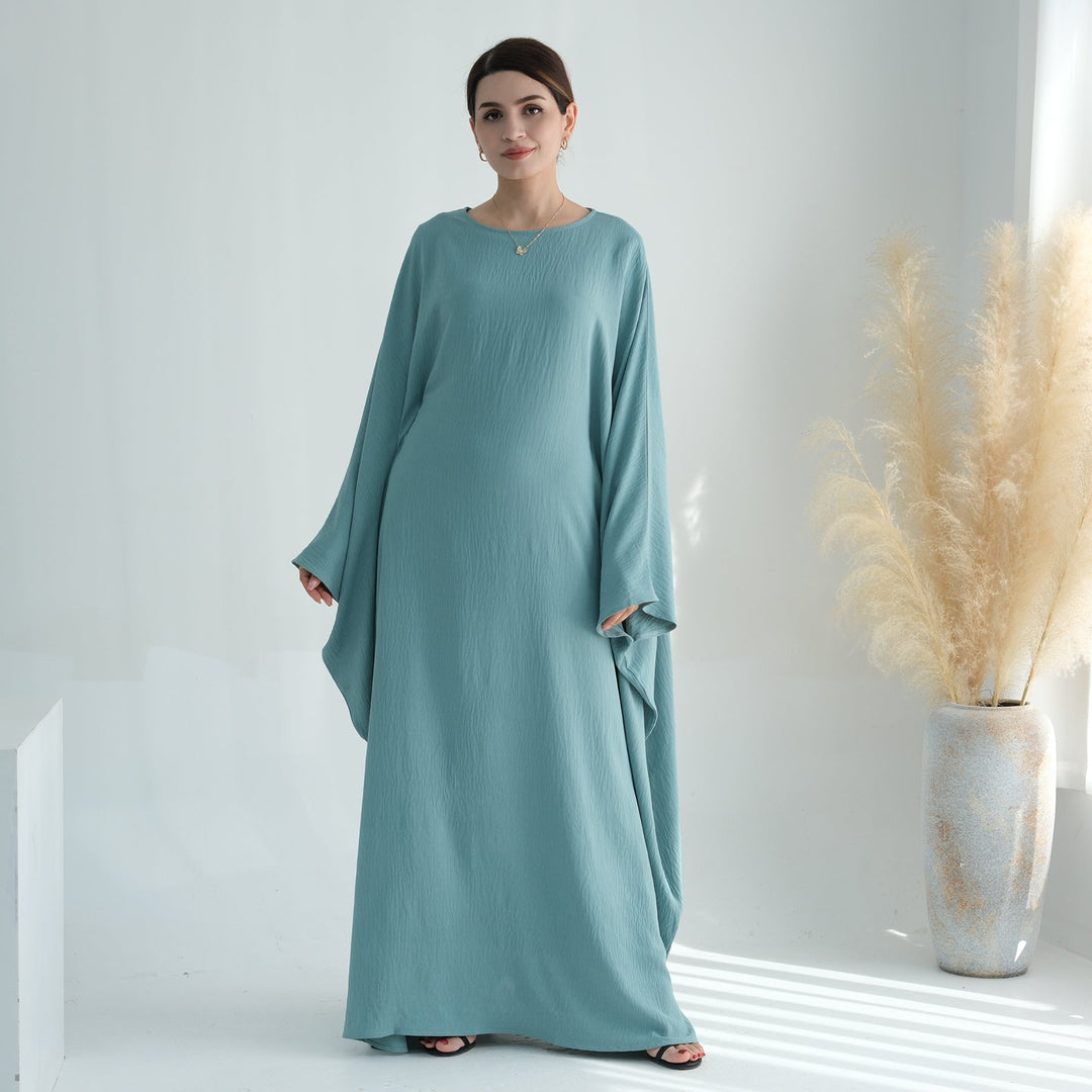 Get trendy with Naimah Textured Butterfly Abaya - Turquoise -  available at Voilee NY. Grab yours for $54.90 today!