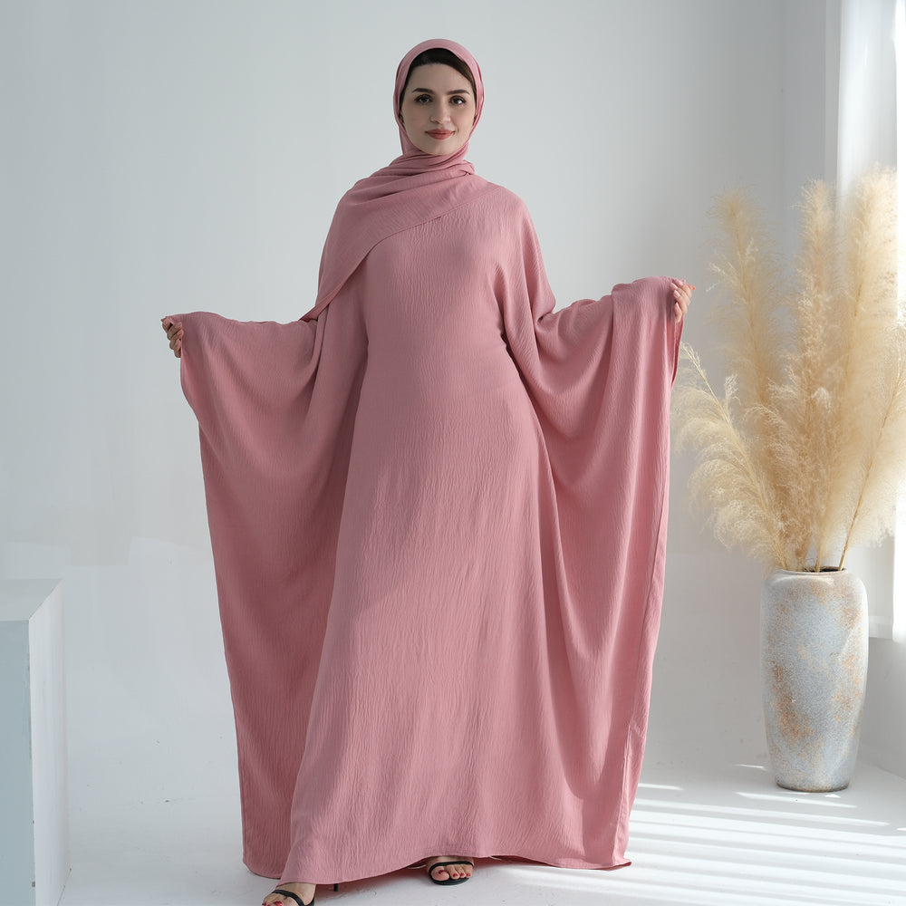 Get trendy with Naimah Textured Butterfly Abaya - Pink Coral -  available at Voilee NY. Grab yours for $54.90 today!