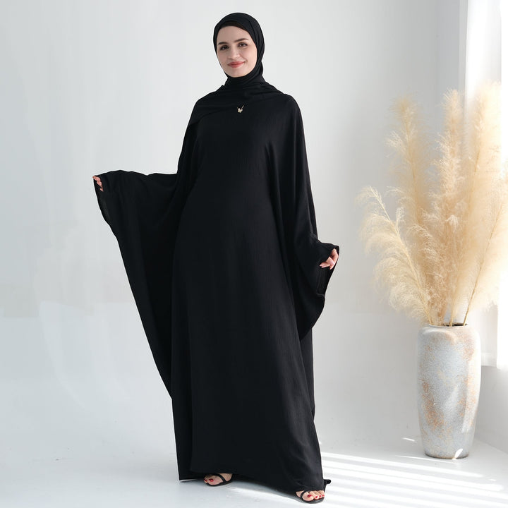 Get trendy with Naimah Textured Butterfly Abaya - Black -  available at Voilee NY. Grab yours for $54.90 today!