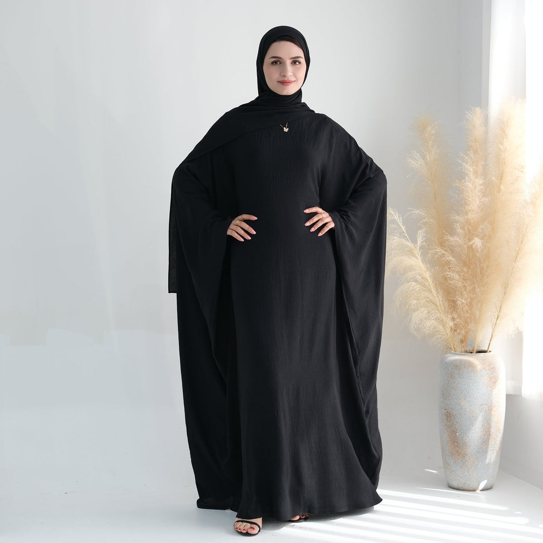 Get trendy with Naimah Textured Butterfly Abaya - Black -  available at Voilee NY. Grab yours for $54.90 today!