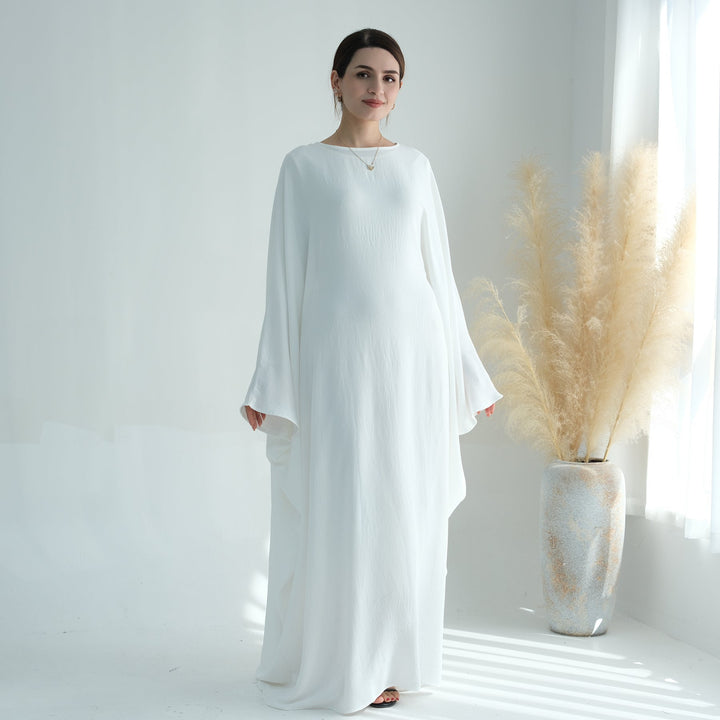 Get trendy with Naimah Textured Butterfly Abaya - White -  available at Voilee NY. Grab yours for $54.90 today!