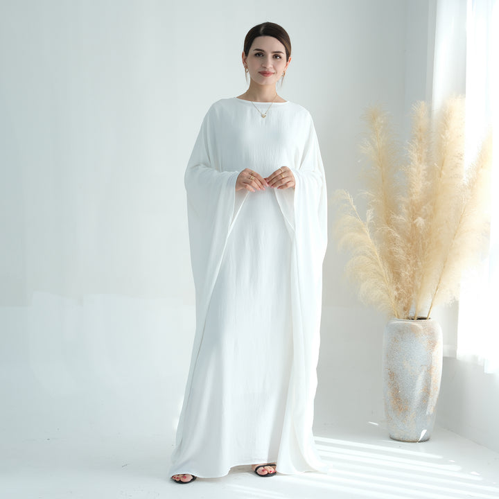 Get trendy with Naimah Textured Butterfly Abaya - White -  available at Voilee NY. Grab yours for $54.90 today!