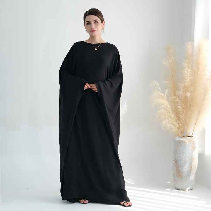 Get trendy with Naimah Textured Butterfly Abaya - Black -  available at Voilee NY. Grab yours for $54.90 today!