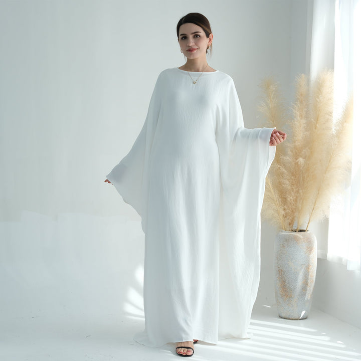 Get trendy with Naimah Textured Butterfly Abaya - White -  available at Voilee NY. Grab yours for $54.90 today!