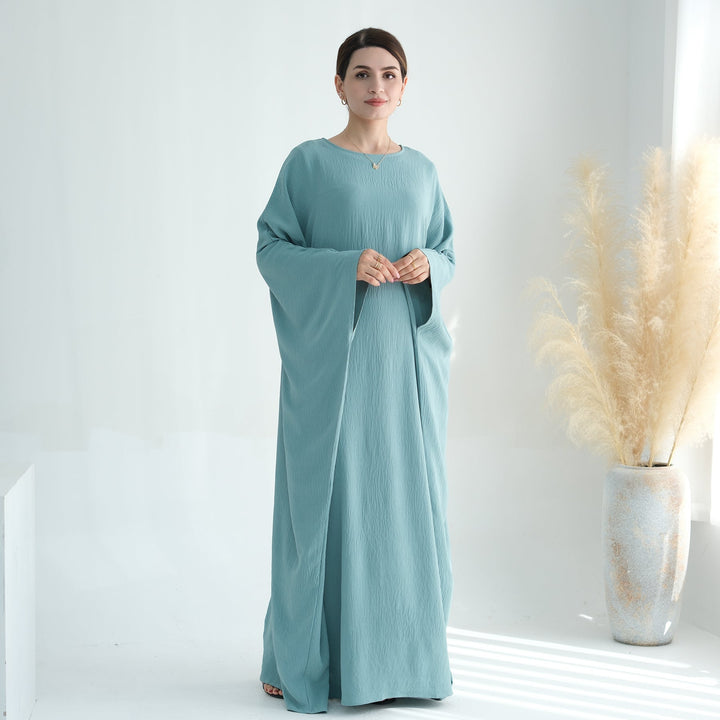 Get trendy with Naimah Textured Butterfly Abaya - Turquoise -  available at Voilee NY. Grab yours for $54.90 today!
