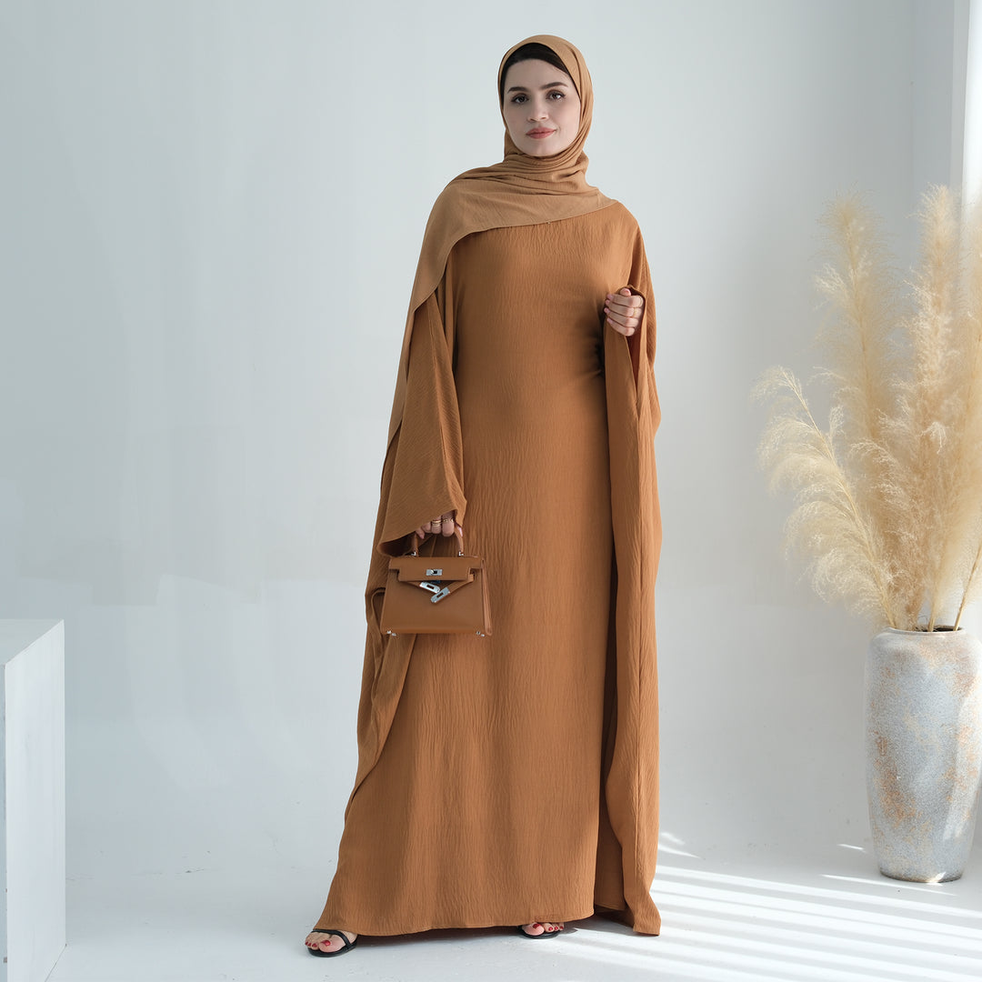 Get trendy with Naimah Textured Butterfly Abaya - Mustard -  available at Voilee NY. Grab yours for $54.90 today!