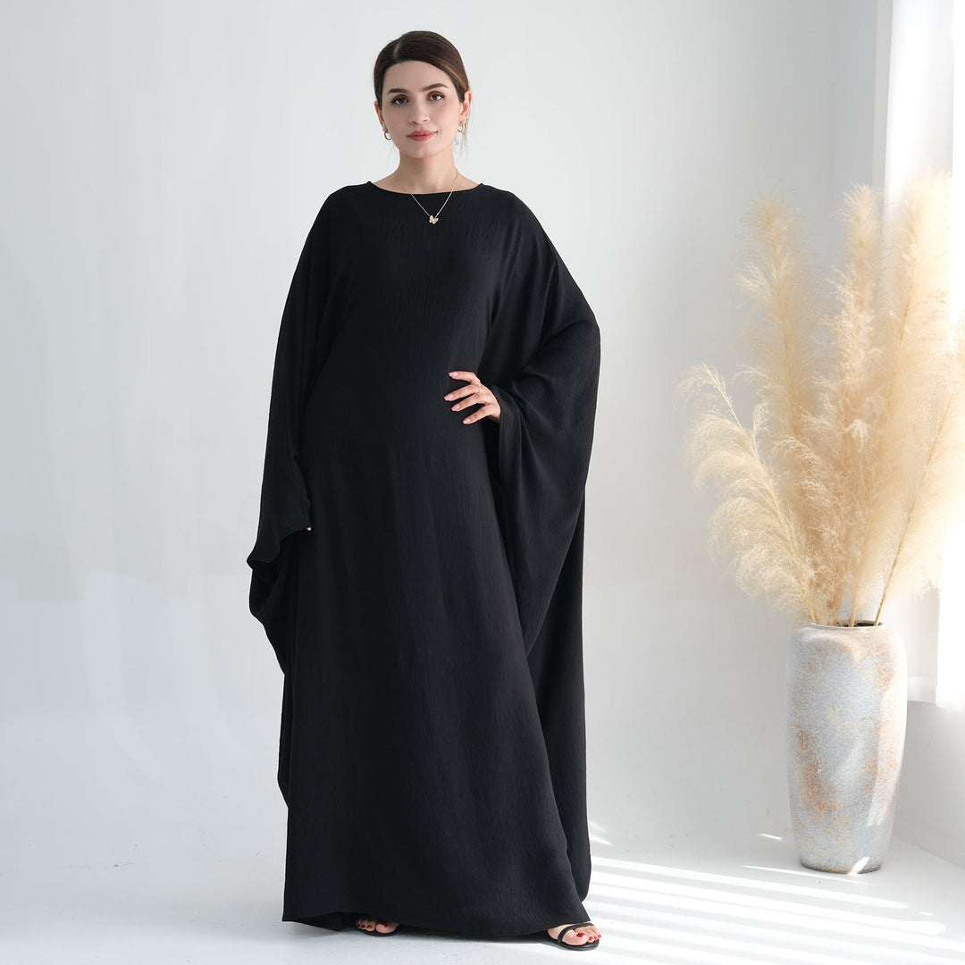 Get trendy with Naimah Textured Butterfly Abaya - Black -  available at Voilee NY. Grab yours for $54.90 today!