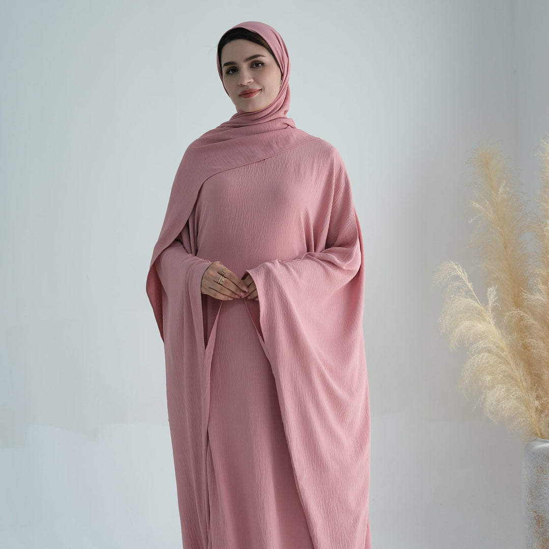 Get trendy with Naimah Textured Butterfly Abaya - Pink Coral -  available at Voilee NY. Grab yours for $54.90 today!