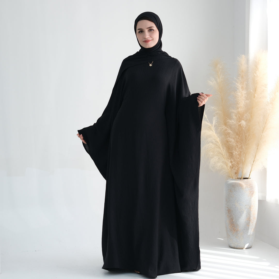 Get trendy with Naimah Textured Butterfly Abaya - Black -  available at Voilee NY. Grab yours for $54.90 today!