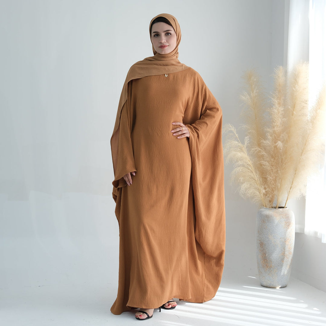 Get trendy with Naimah Textured Butterfly Abaya - Mustard -  available at Voilee NY. Grab yours for $54.90 today!