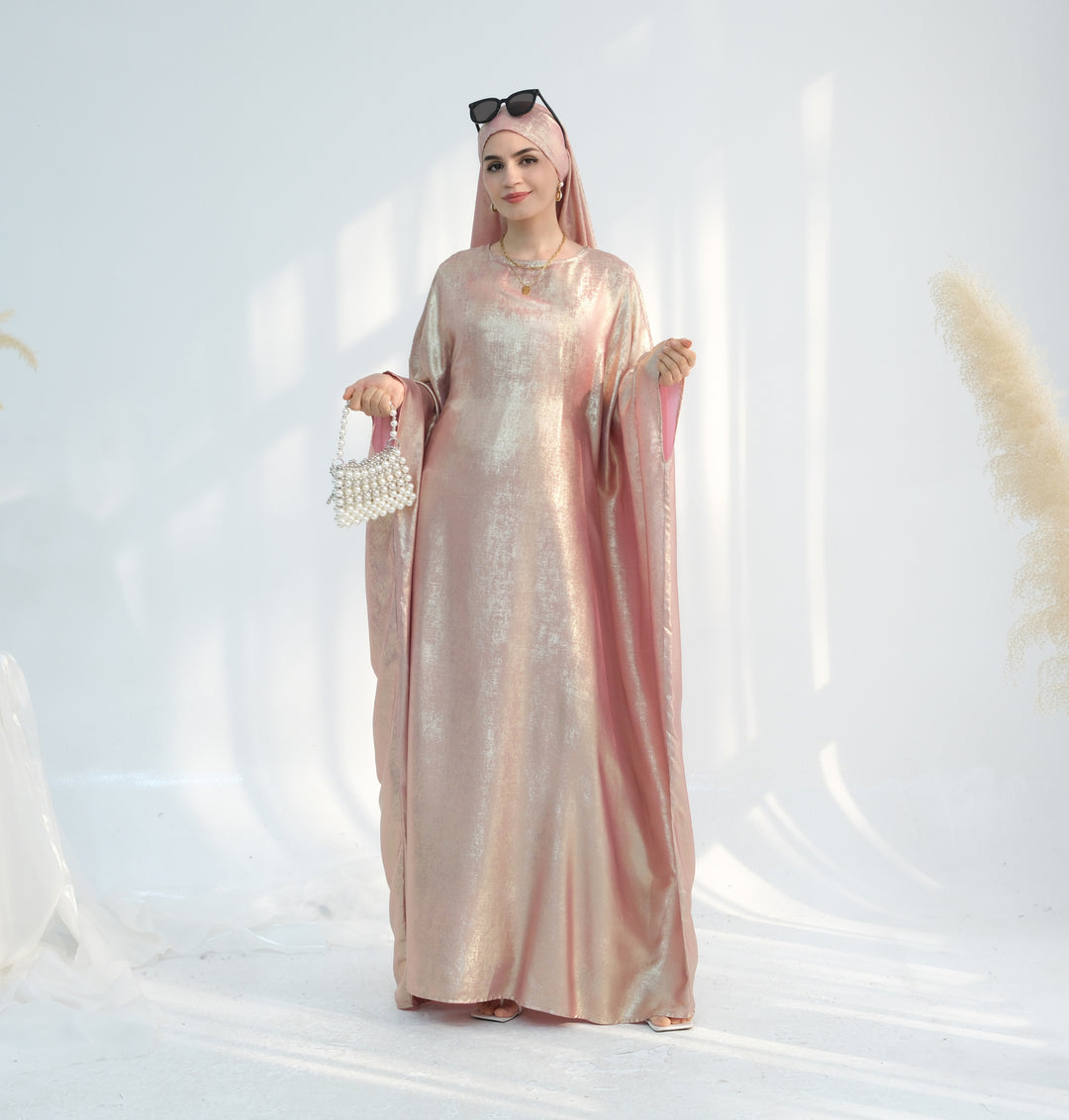 Get trendy with Linora Shimmer Butterfly Abaya - Peach - Dresses available at Voilee NY. Grab yours for $59.90 today!