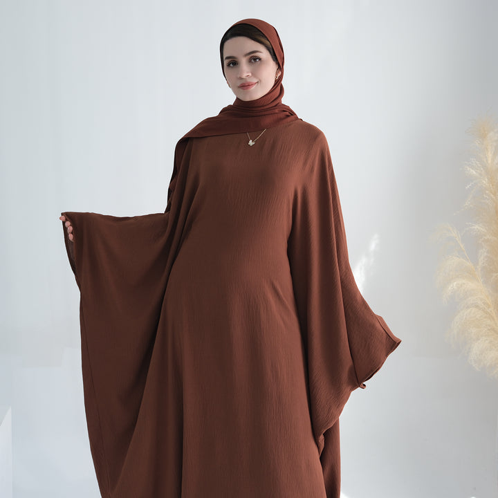 Get trendy with Naimah Textured Butterfly Abaya - Brown -  available at Voilee NY. Grab yours for $54.90 today!