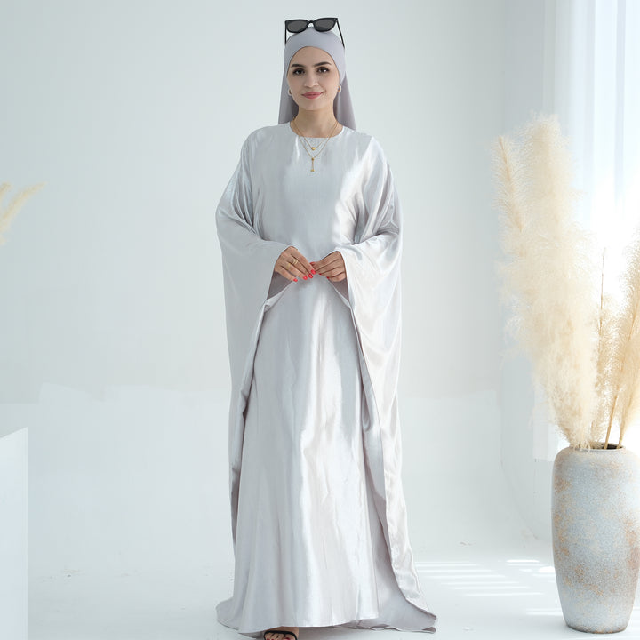 Get trendy with Alisha Butterfly Satin Abaya - Dove - Dresses available at Voilee NY. Grab yours for $72.90 today!