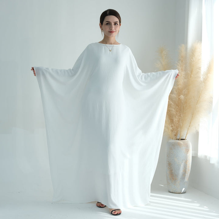 Get trendy with Naimah Textured Butterfly Abaya - White -  available at Voilee NY. Grab yours for $54.90 today!