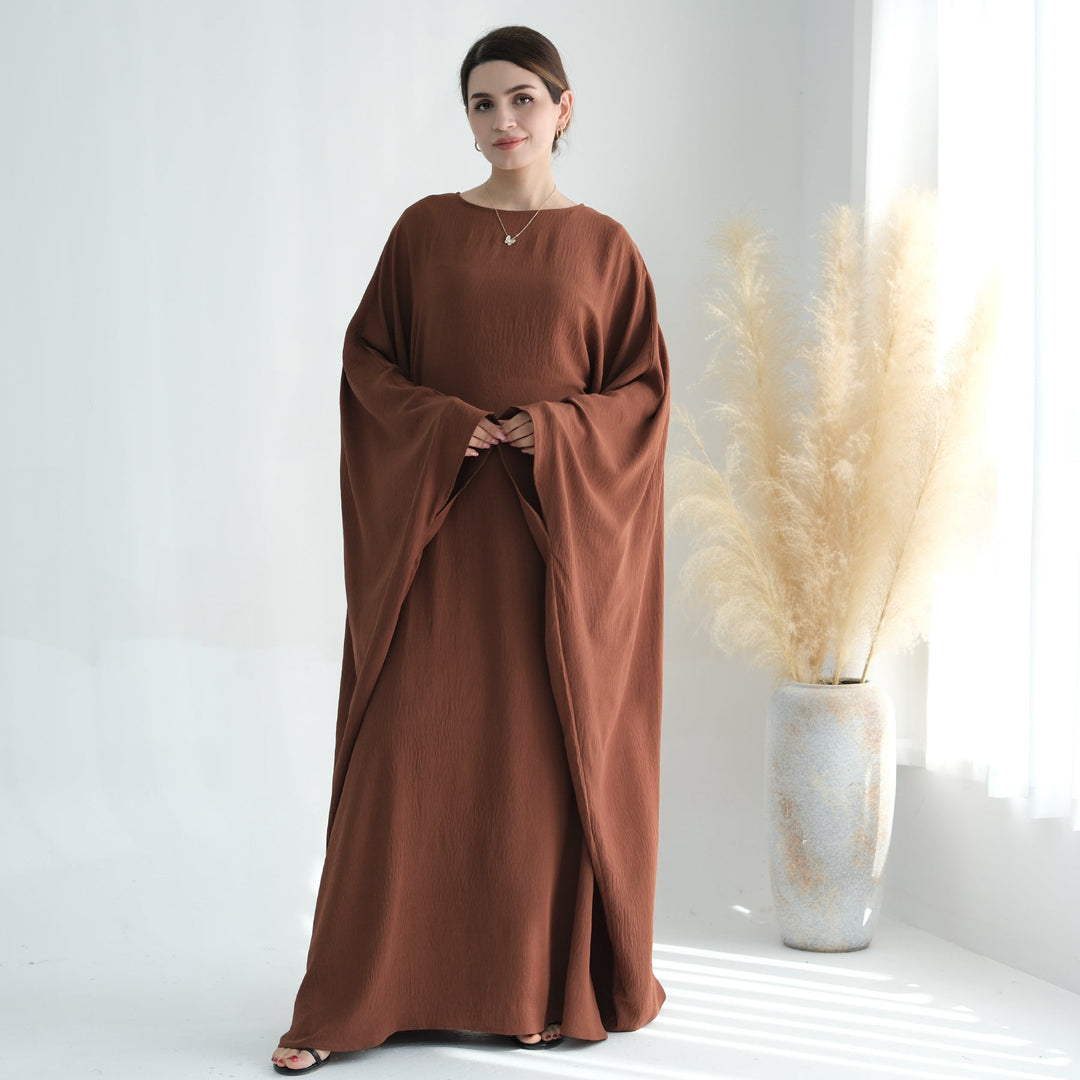 Get trendy with Naimah Textured Butterfly Abaya - Brown -  available at Voilee NY. Grab yours for $54.90 today!