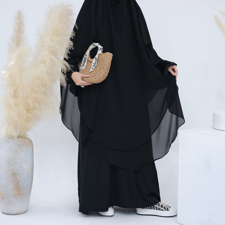 Get trendy with 2-layer Maxi Chiffon Khimar - Black -  available at Voilee NY. Grab yours for $44.90 today!