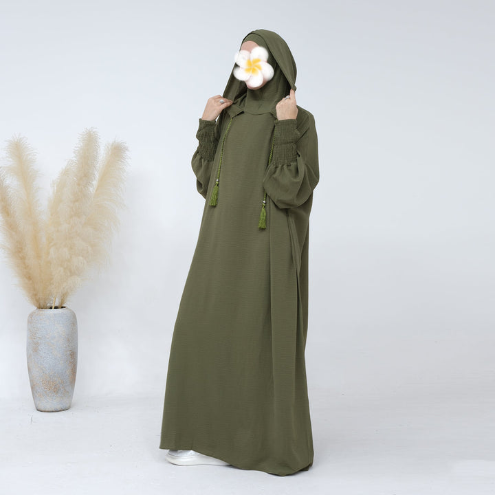 Get trendy with Rubina Double Hoodie Abaya - Olive - Dresses available at Voilee NY. Grab yours for $59.99 today!