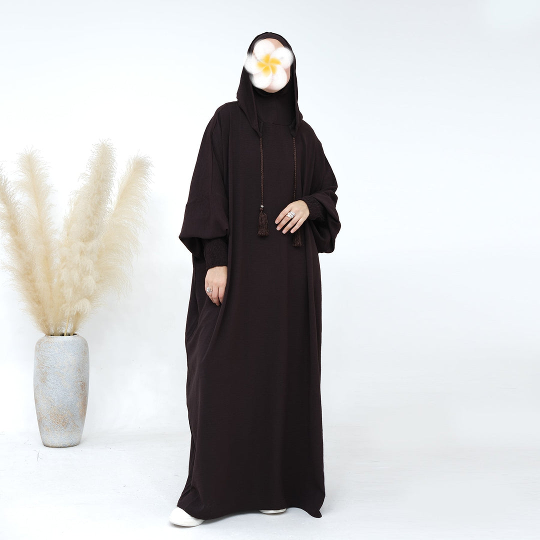 Get trendy with Rubina Double Hoodie Abaya - Coffee - Dresses available at Voilee NY. Grab yours for $59.99 today!