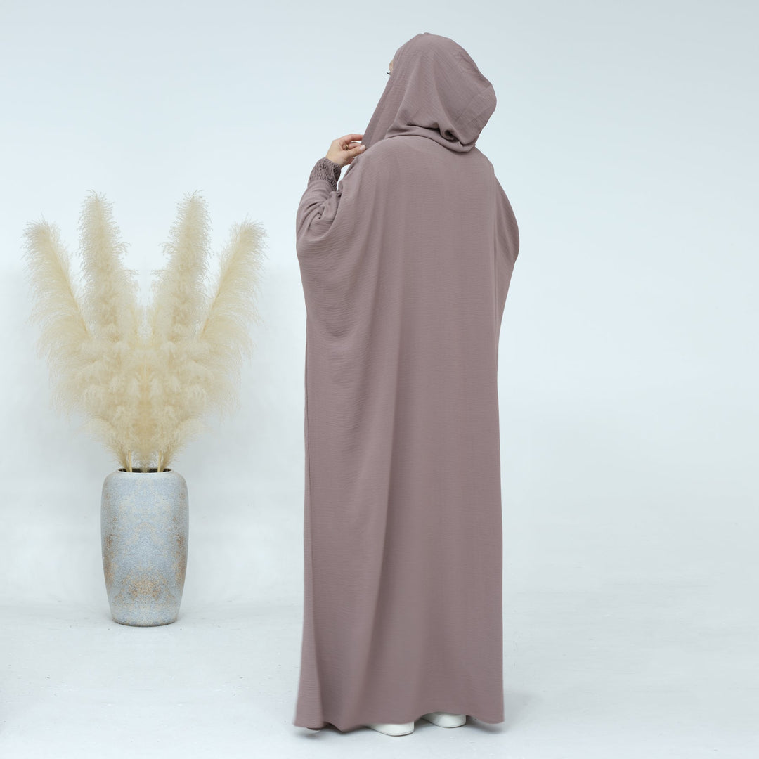 Get trendy with Rubina Double Hoodie Abaya - Latte - Dresses available at Voilee NY. Grab yours for $59.99 today!