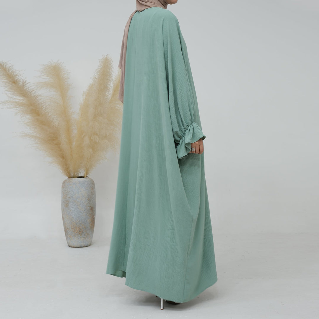 Get trendy with Dimma Bell Cuffs Abaya - Mint - Dresses available at Voilee NY. Grab yours for $54.90 today!