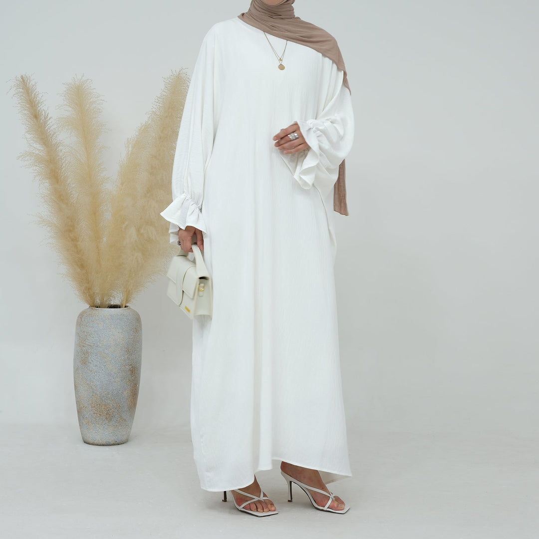 Get trendy with Dimma Bell Cuffs Abaya - White - Dresses available at Voilee NY. Grab yours for $54.90 today!