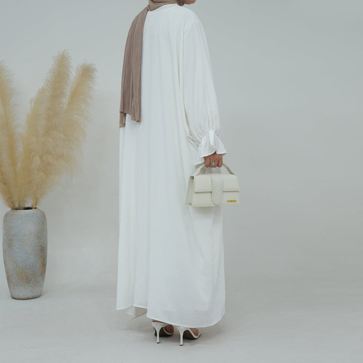 Get trendy with Dimma Bell Cuffs Abaya - White - Dresses available at Voilee NY. Grab yours for $54.90 today!