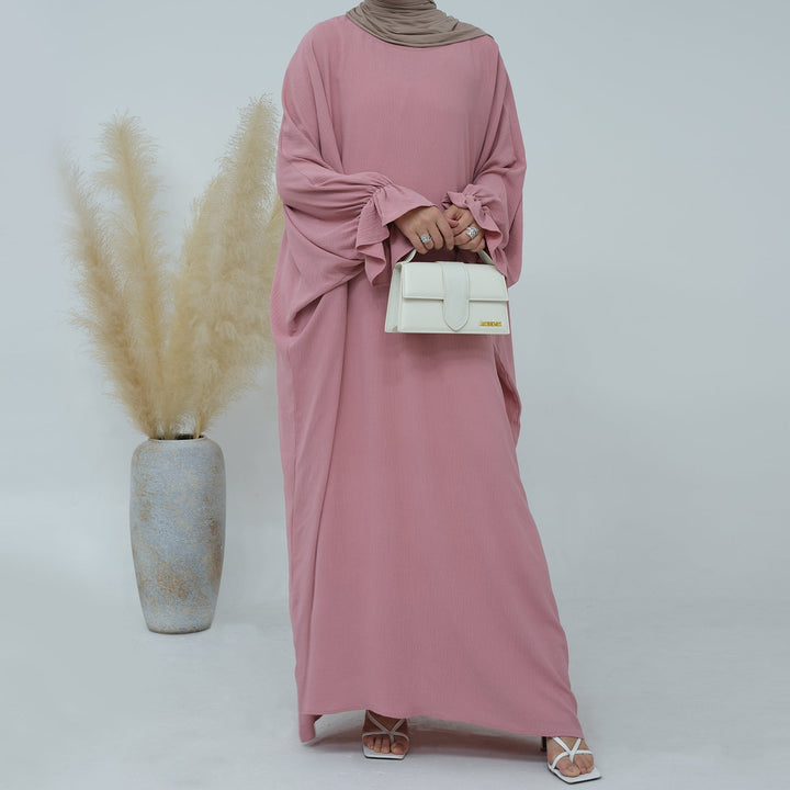 Get trendy with Dimma Bell Cuffs Abaya - Pink Coral - Dresses available at Voilee NY. Grab yours for $54.90 today!