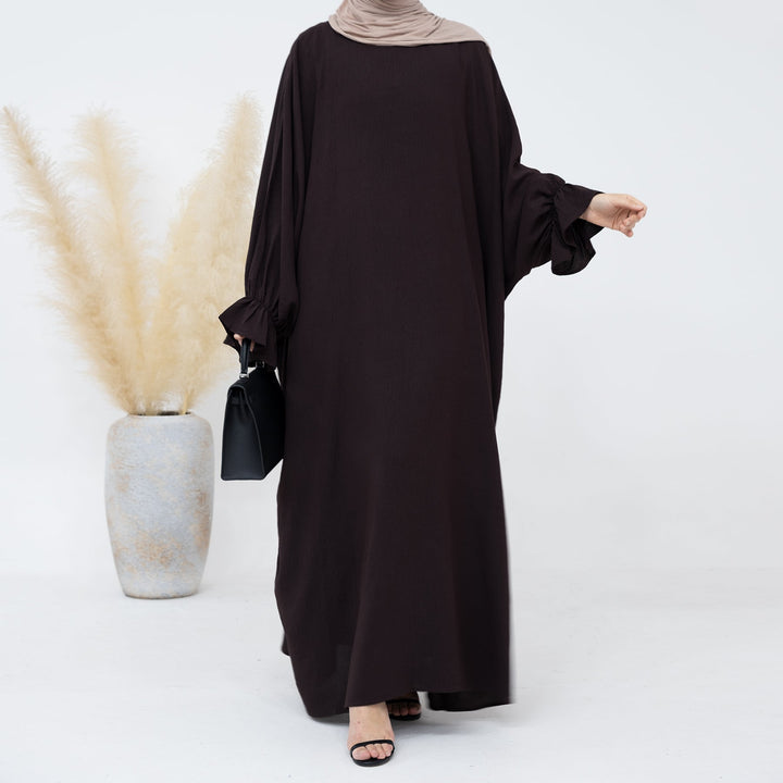 Get trendy with Dimma Bell Cuffs Abaya - Coffee - Dresses available at Voilee NY. Grab yours for $54.90 today!
