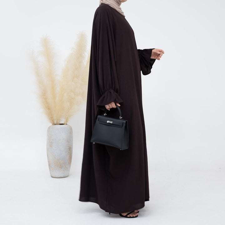 Get trendy with Dimma Bell Cuffs Abaya - Coffee - Dresses available at Voilee NY. Grab yours for $54.90 today!