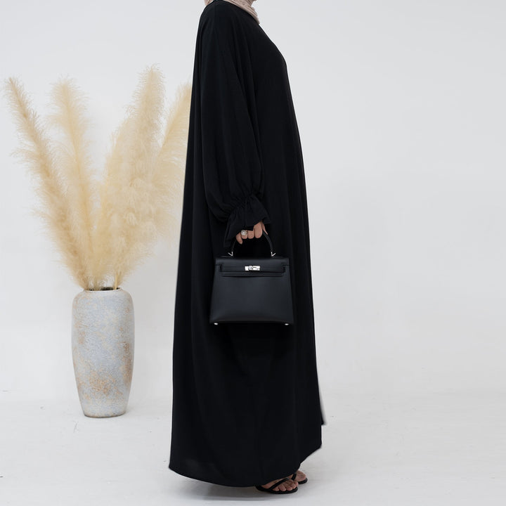 Get trendy with Dimma Bell Cuffs Abaya - Black - Dresses available at Voilee NY. Grab yours for $54.90 today!