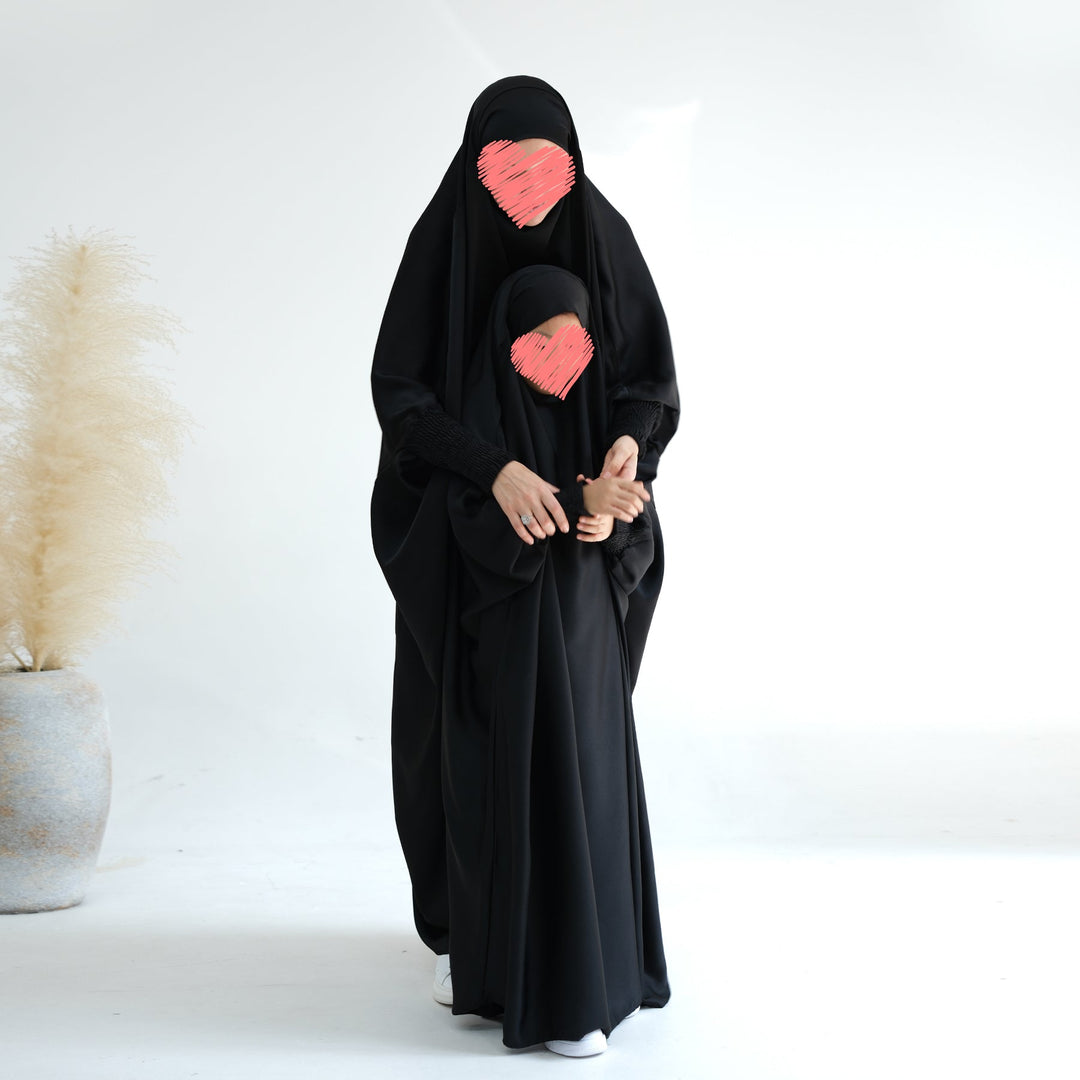 Get trendy with Marwa Kids Satin Jilbab - Black - Dresses available at Voilee NY. Grab yours for $39.90 today!
