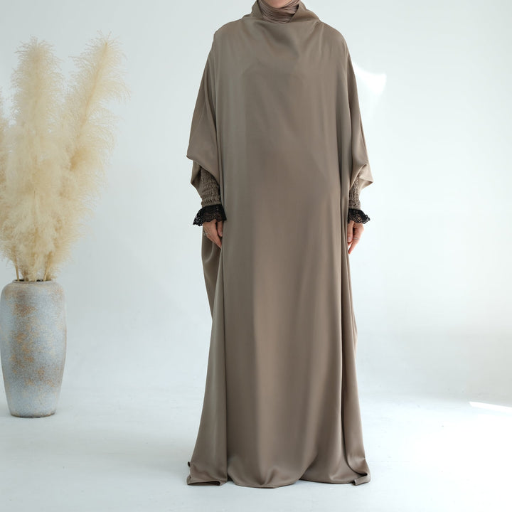 Get trendy with Marwa Satin Jilbab - Ash - Dresses available at Voilee NY. Grab yours for $44.99 today!