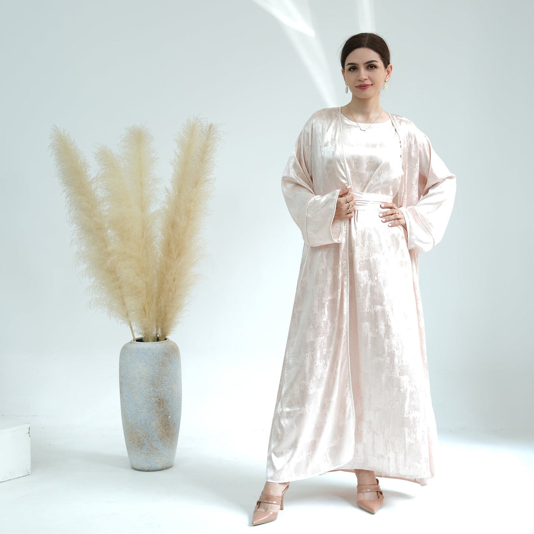 Get trendy with Brielle Satin Open Abaya - Blushing Peach - Dresses available at Voilee NY. Grab yours for $64.90 today!