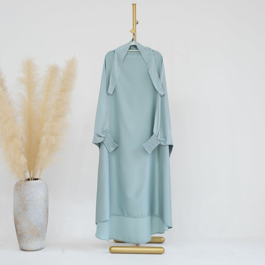 Get trendy with Marwa Kids Satin Jilbab - Mint - Dresses available at Voilee NY. Grab yours for $39.90 today!