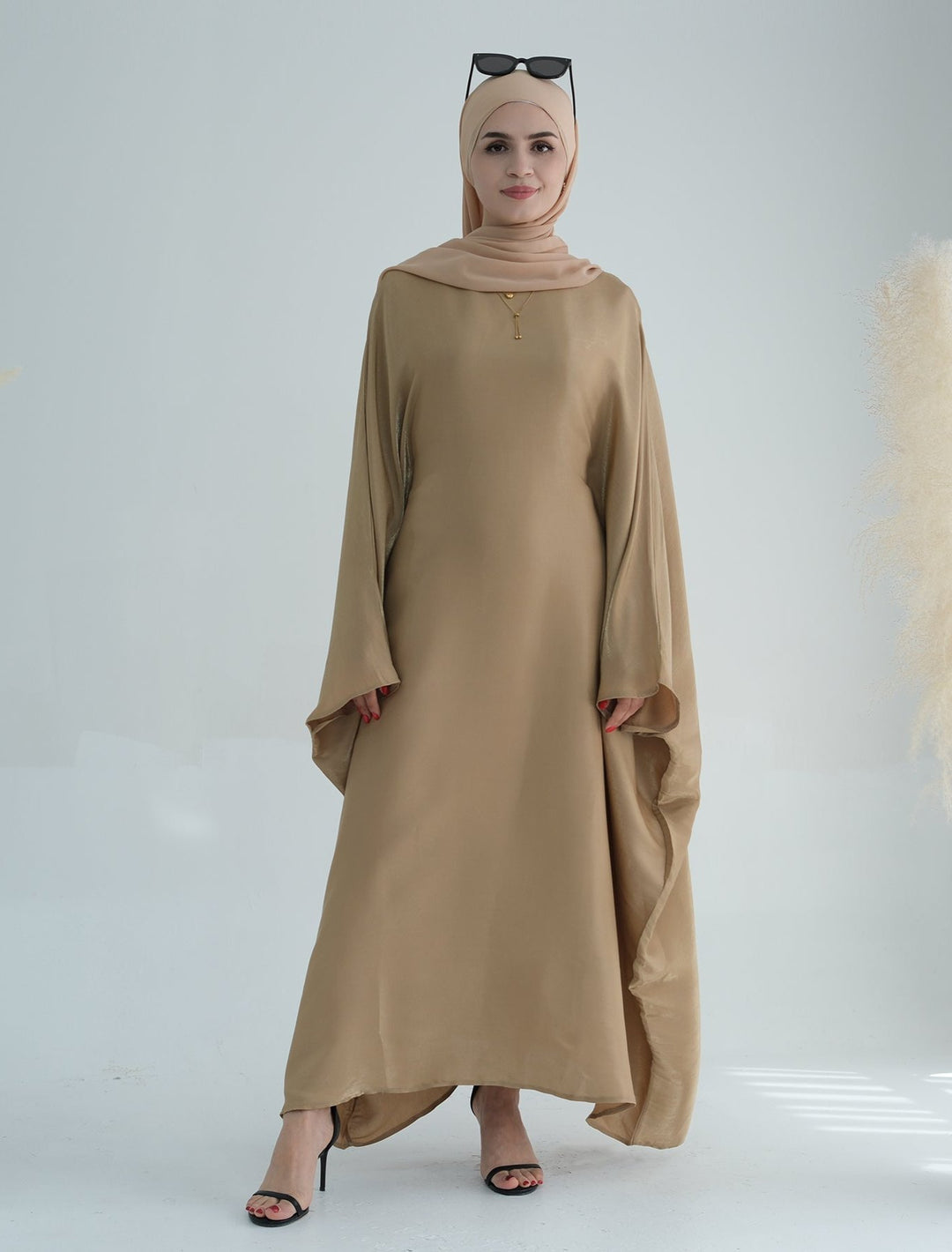 Get trendy with Yuna Shimmer Butterfly Abaya - Tan Brown -  available at Voilee NY. Grab yours for $59.90 today!