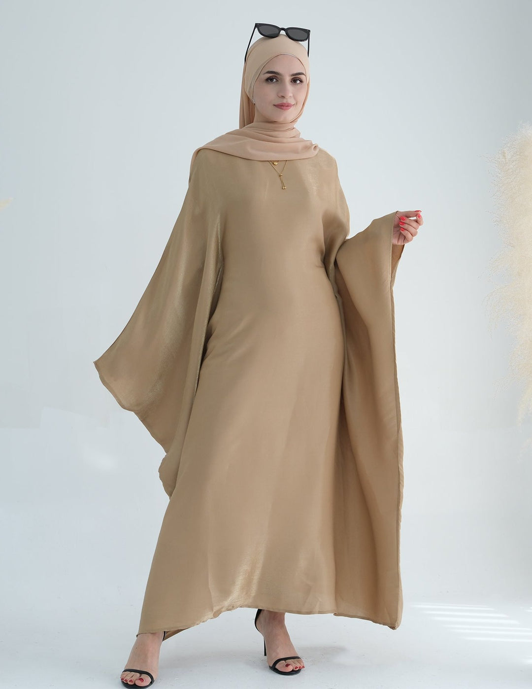 Get trendy with Yuna Shimmer Butterfly Abaya - Tan Brown -  available at Voilee NY. Grab yours for $59.90 today!