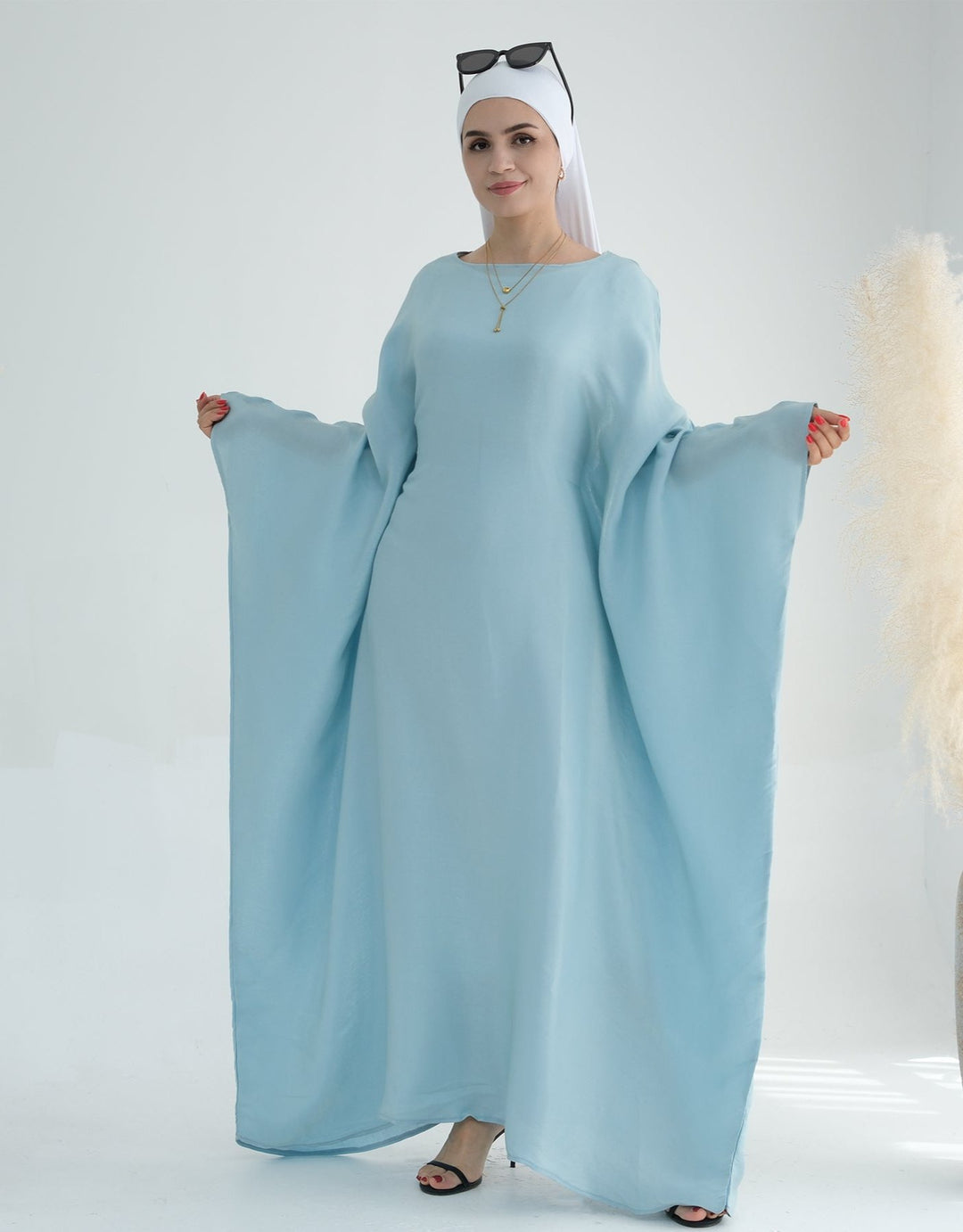 Get trendy with Yuna Shimmer Butterfly Abaya - Blue -  available at Voilee NY. Grab yours for $59.90 today!