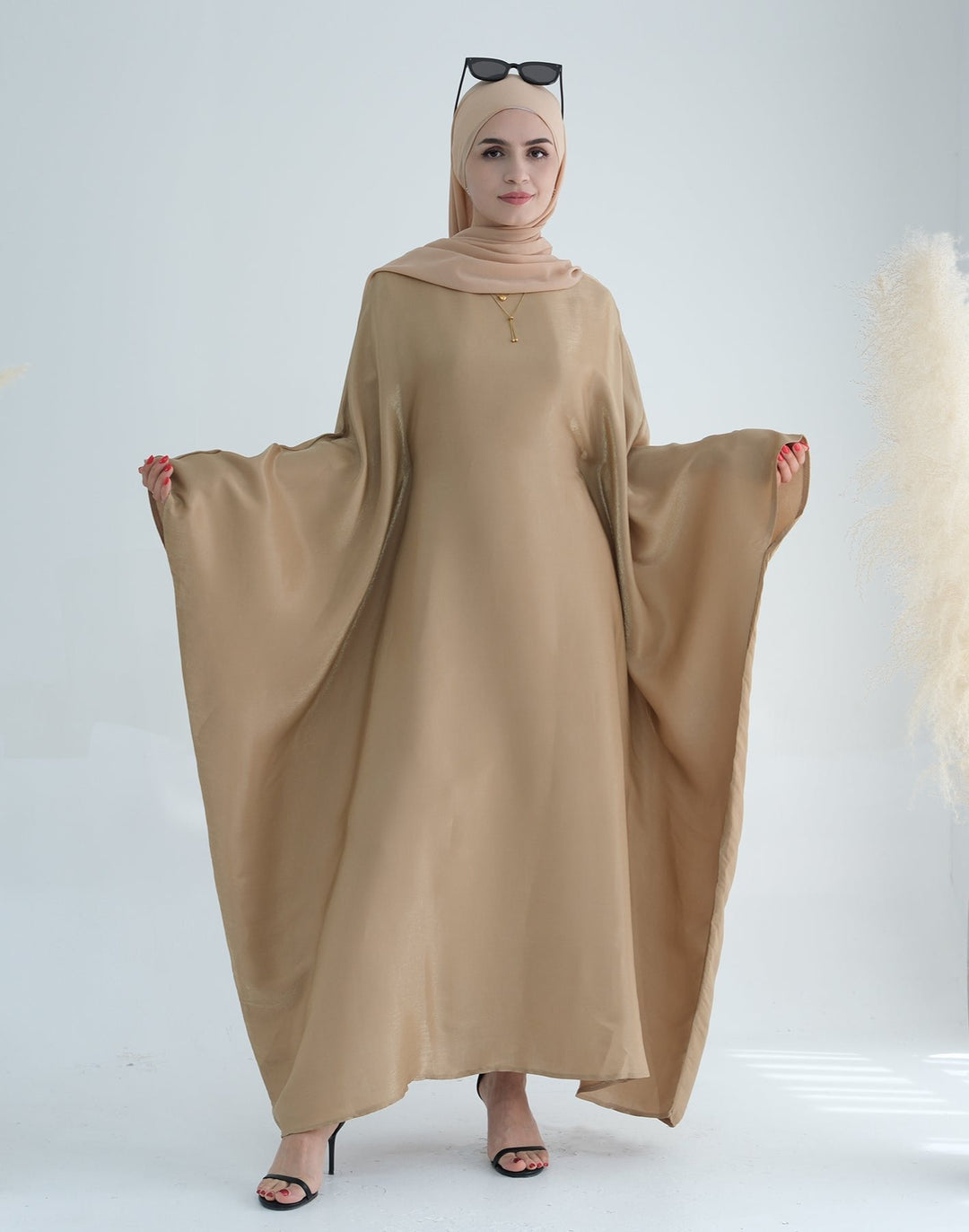 Get trendy with Yuna Shimmer Butterfly Abaya - Tan Brown -  available at Voilee NY. Grab yours for $59.90 today!