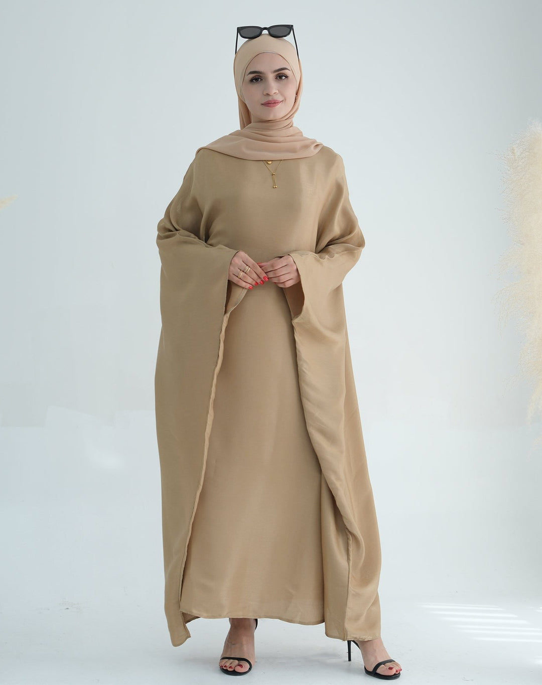 Get trendy with Yuna Shimmer Butterfly Abaya - Tan Brown -  available at Voilee NY. Grab yours for $59.90 today!