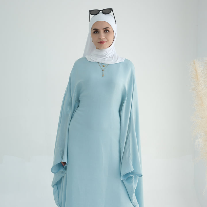 Get trendy with Yuna Shimmer Butterfly Abaya - Blue -  available at Voilee NY. Grab yours for $59.90 today!