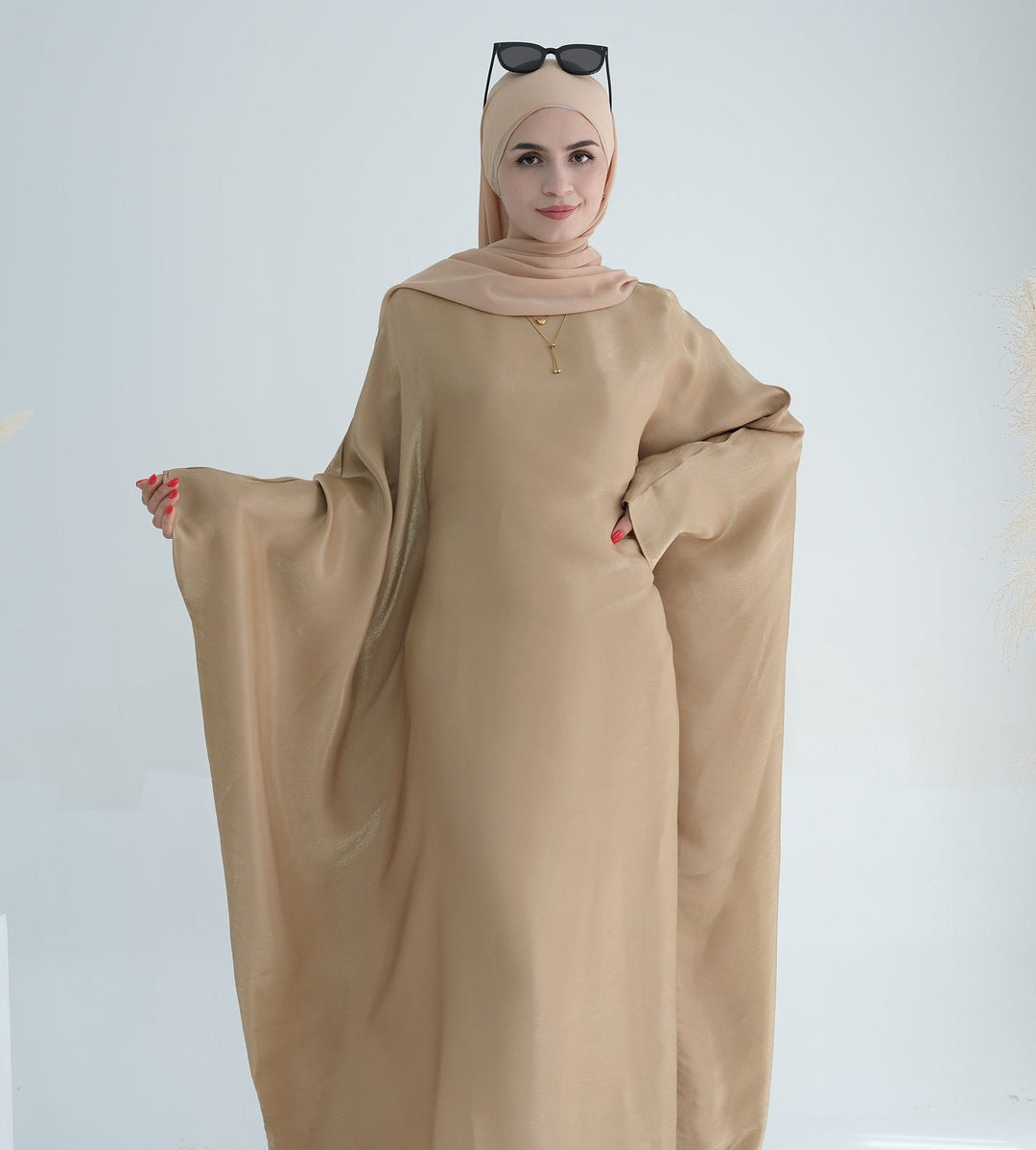 Get trendy with Yuna Shimmer Butterfly Abaya - Tan Brown -  available at Voilee NY. Grab yours for $59.90 today!