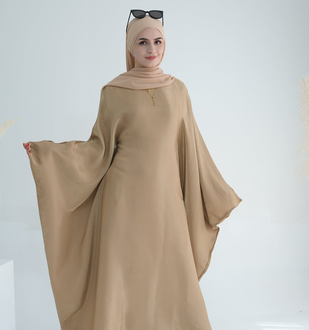 Get trendy with Yuna Shimmer Butterfly Abaya - Tan Brown -  available at Voilee NY. Grab yours for $59.90 today!