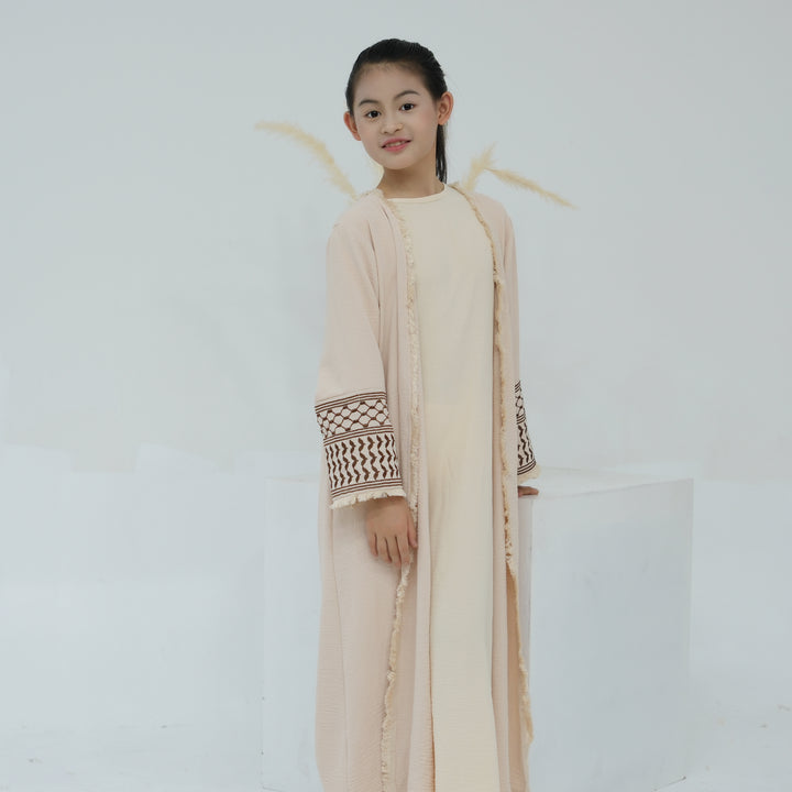 Get trendy with Kids Kufiya Open Abaya - Sand -  available at Voilee NY. Grab yours for $39.90 today!