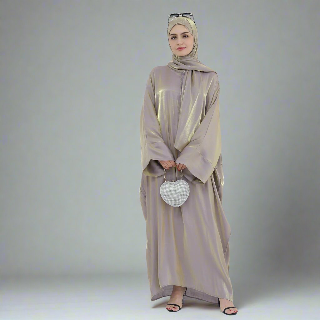 Get trendy with Nessa Shimmer Abaya with Hijab - Beige - Dresses available at Voilee NY. Grab yours for $54.90 today!