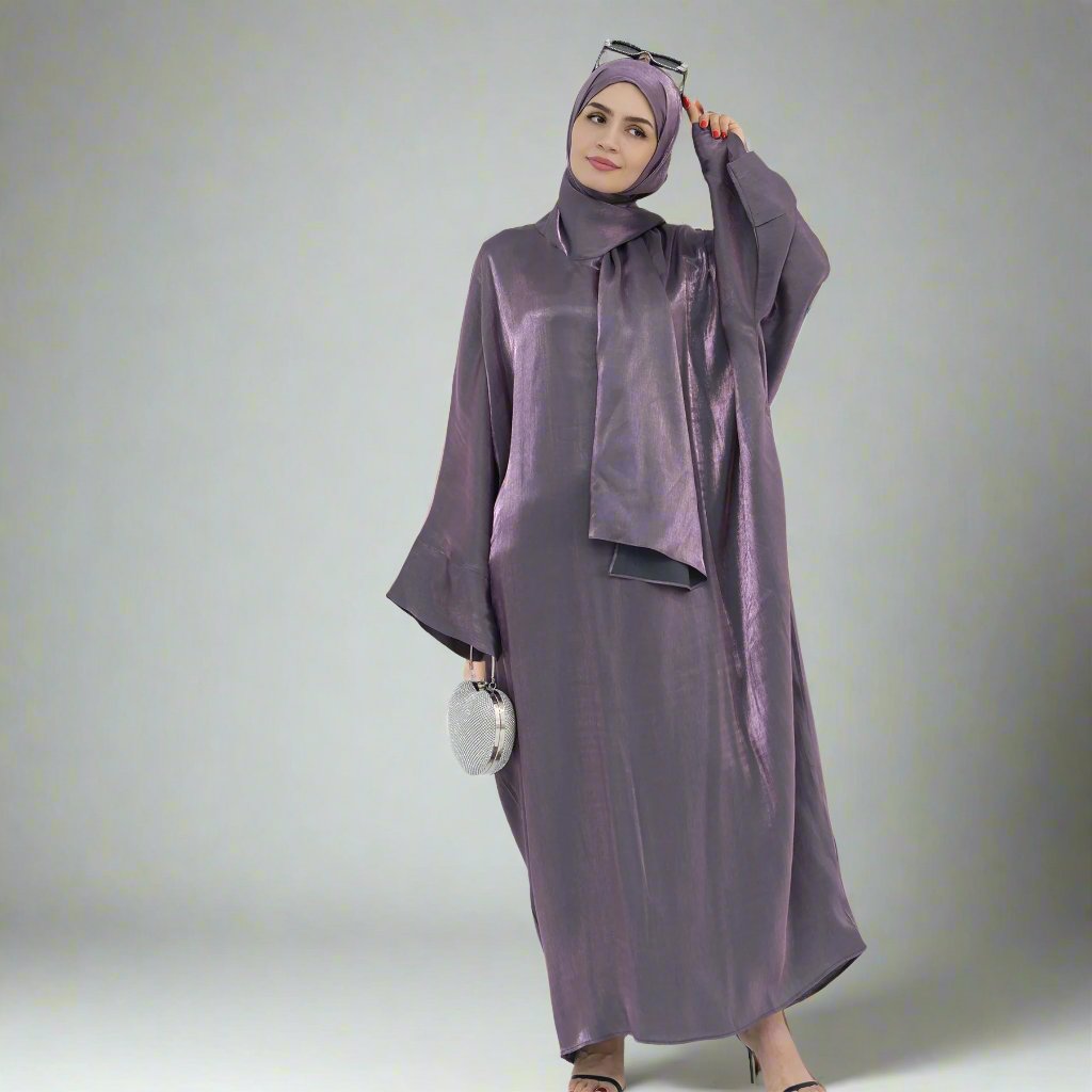 Get trendy with Nessa Shimmer Abaya with Hijab - Eggplant - Dresses available at Voilee NY. Grab yours for $54.90 today!