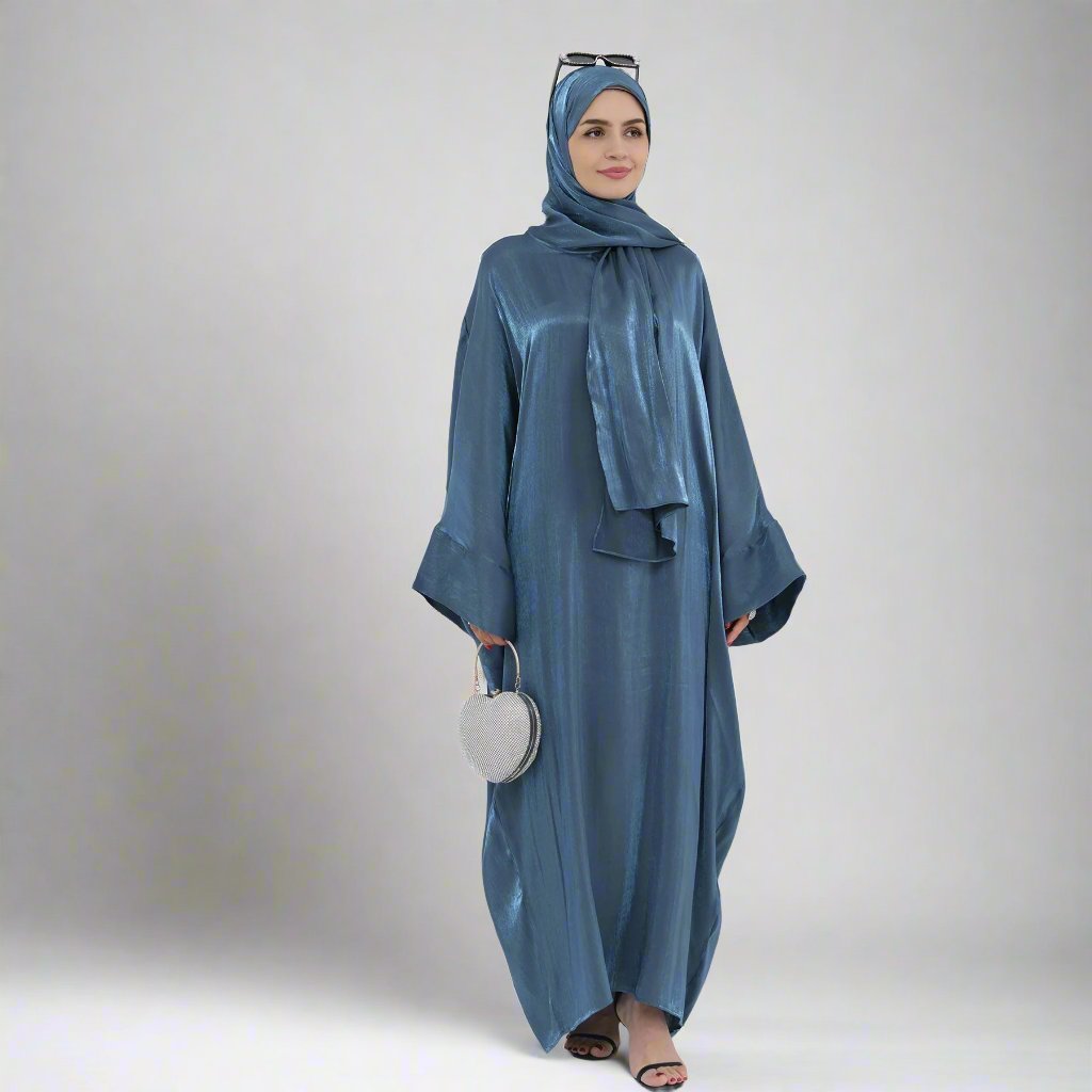 Get trendy with Nessa Shimmer Abaya with Hijab - Teal - Dresses available at Voilee NY. Grab yours for $54.90 today!